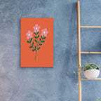 Pink And Green Flower Trio On Orange by Club Daydream - 16x24 acrylic wall art in a room